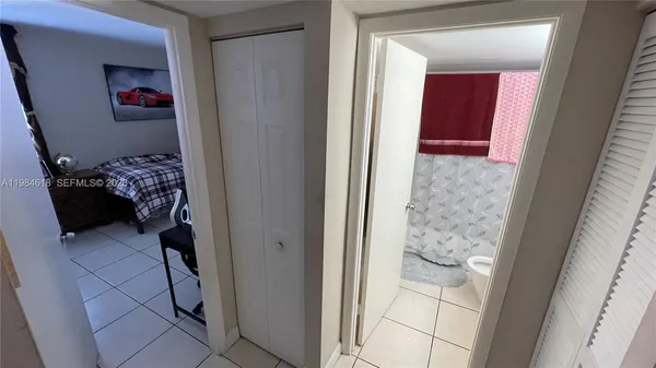 a bathroom with a sink toilet vanity and mirror