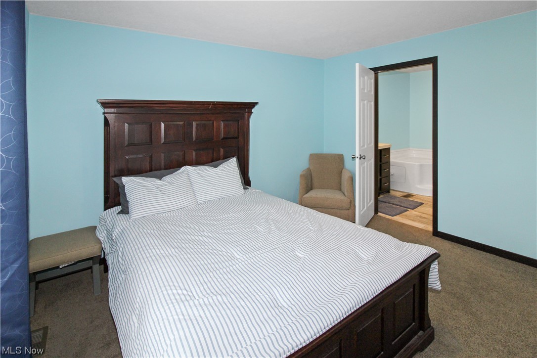 1609 Coldwater Crossing Road Lakeside Marblehead, OH 43440 - Photo 27 of 38 Carpeted bedroom with connected bathroom