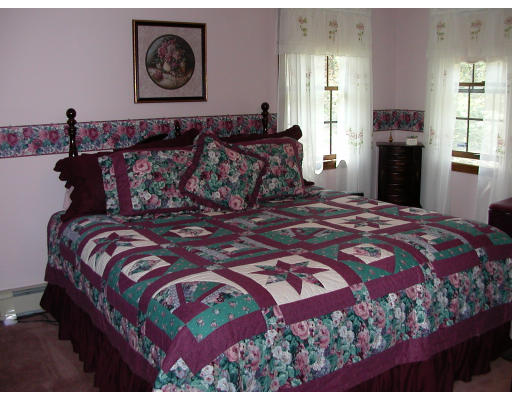 12 Crooks Road North Brookfield, MA 01535 - Photo 12 of 16 a bedroom with a bed and a painting on the wall