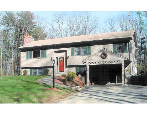 12 Crooks Road North Brookfield, MA 01535 - Photo 2 of 16 a view of a house with a yard and balcony