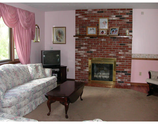12 Crooks Road North Brookfield, MA 01535 - Photo 6 of 16 a living room with furniture and a fireplace