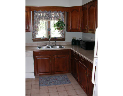 12 Crooks Road North Brookfield, MA 01535 - Photo 9 of 16 a kitchen with a sink and a stove