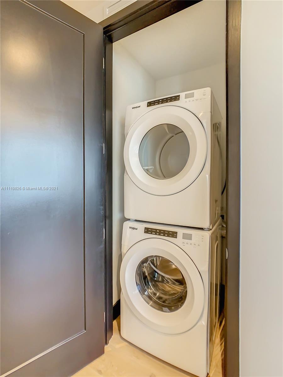 340 Southeast 3rd Street, Unit PH2 Miami, FL 33131 - Photo 28 of 54 a utility room with dryer and washer