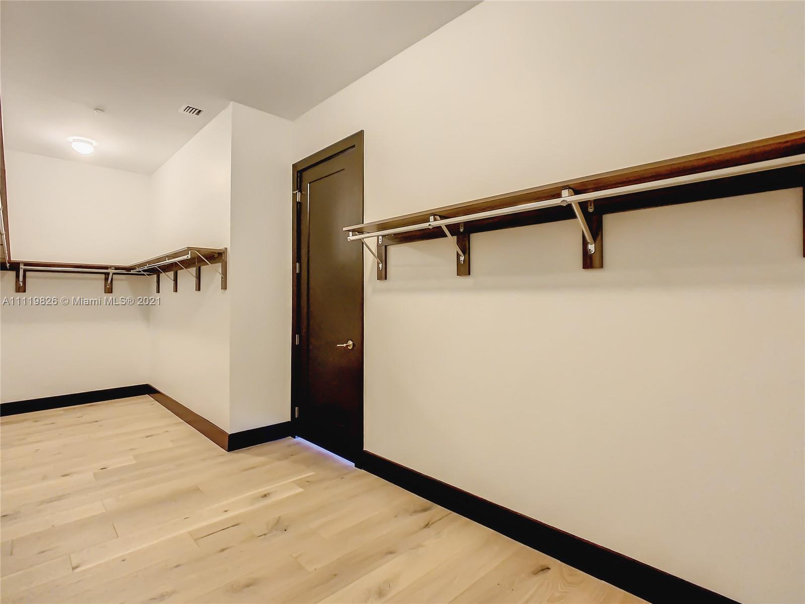 340 Southeast 3rd Street, Unit PH2 Miami, FL 33131 - Photo 29 of 54 a view of a hallway with closet