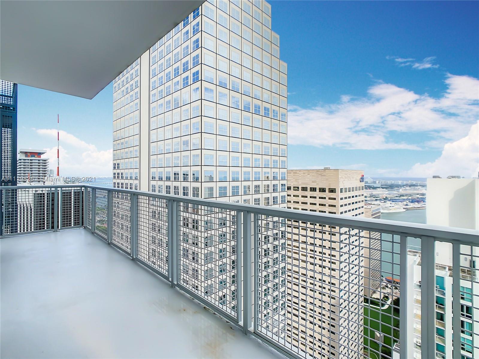 340 Southeast 3rd Street, Unit PH2 Miami, FL 33131 - Photo 34 of 54 a view of a balcony with city view