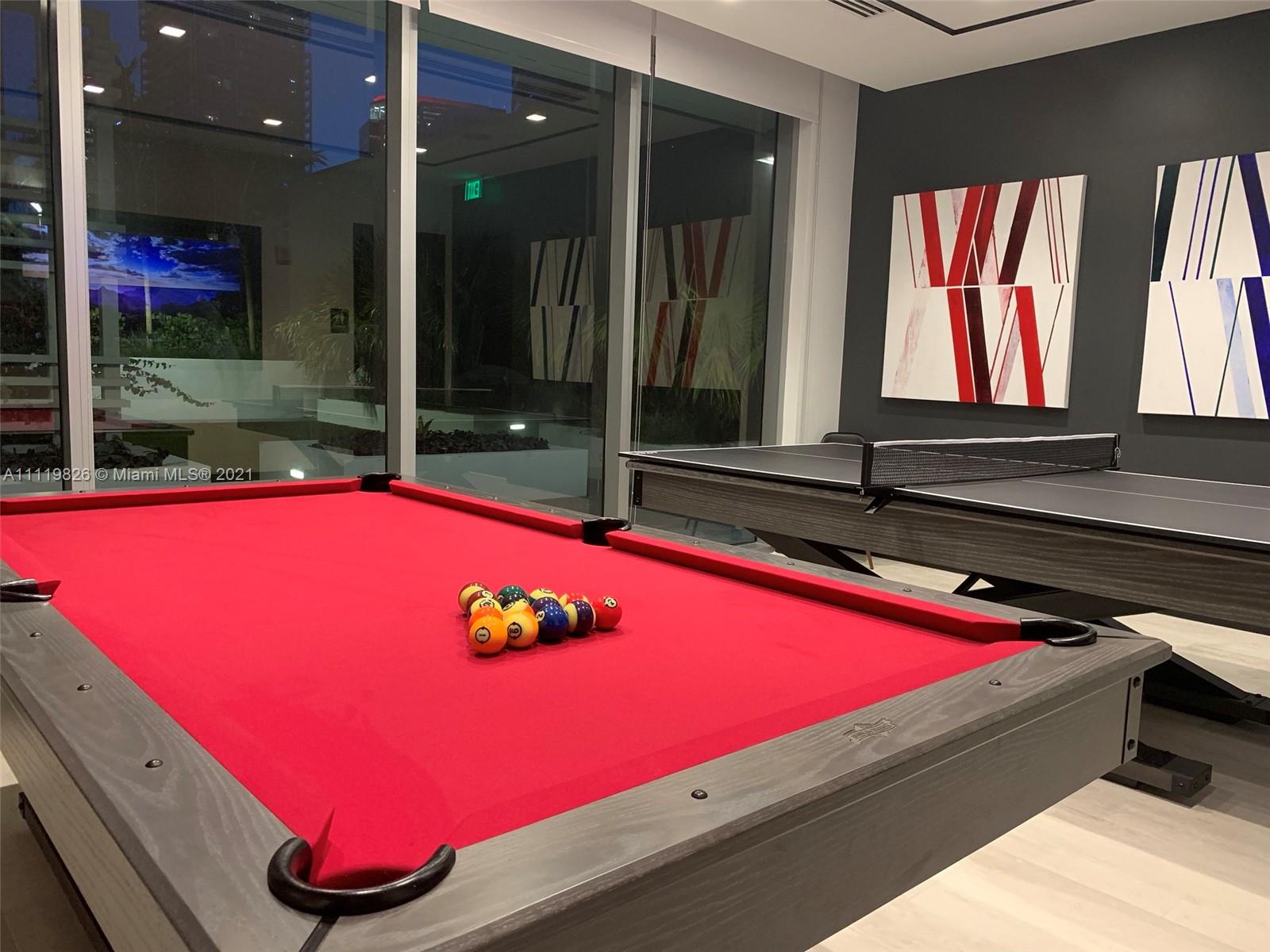 340 Southeast 3rd Street, Unit PH2 Miami, FL 33131 - Photo 43 of 54 a room with pool table and windows