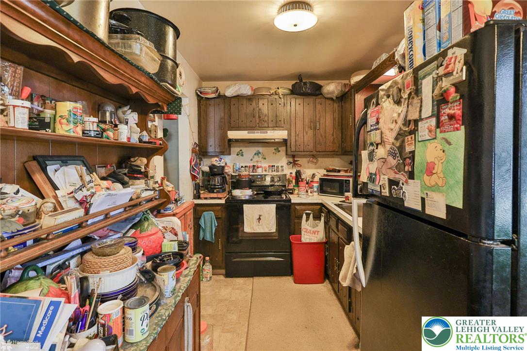 802 West Berwick Street Easton, PA 18042 - Photo 32 of 54 a kitchen with lots of appliances and cabinets