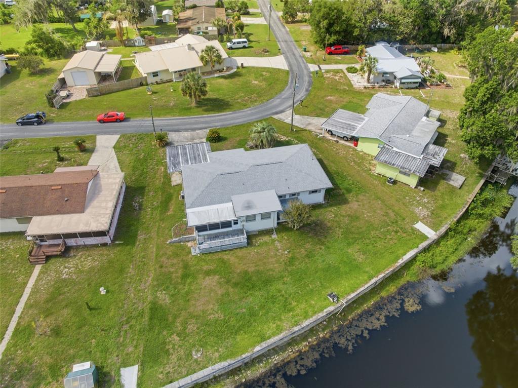 1830 South Mandarin Terrace Inverness, FL 34450 - Photo 36 of 47 an aerial view of a house with a garden and swimming pool