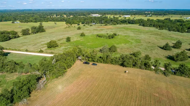 a view of a lake with a yard