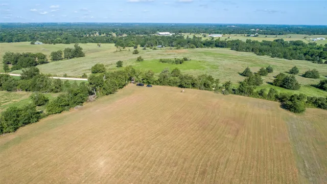 an aerial view of valley and lake