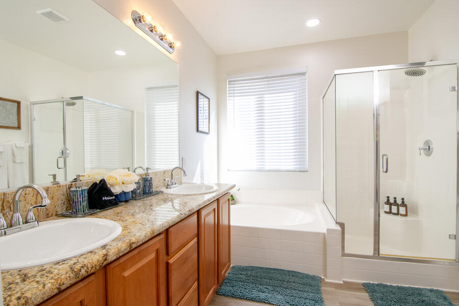 43784 Riunione Place Indio, CA 92203 - Photo 15 of 54 a bathroom with double vanity and a bathtub