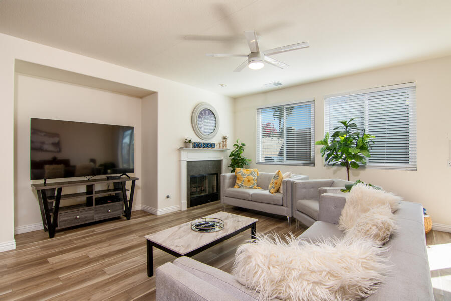43784 Riunione Place Indio, CA 92203 - Photo 3 of 54 a living room with furniture a flat screen tv and a fireplace