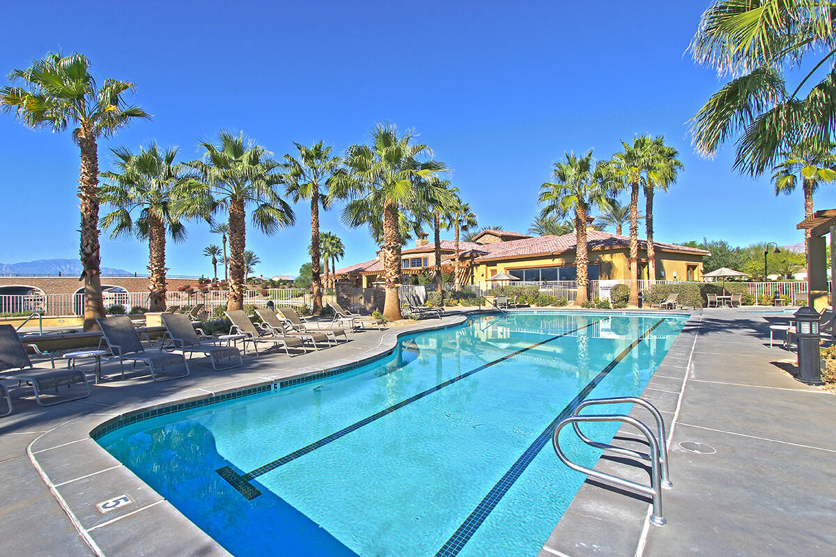 43784 Riunione Place Indio, CA 92203 - Photo 41 of 54 a view of a swimming pool with a table and chairs