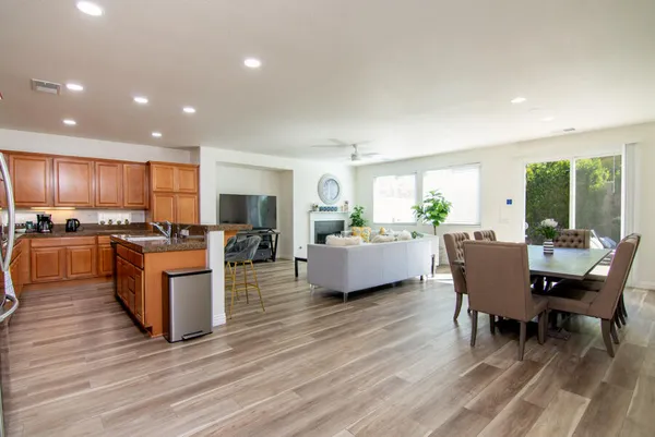 a view of a dining room with furniture window and wooden floor