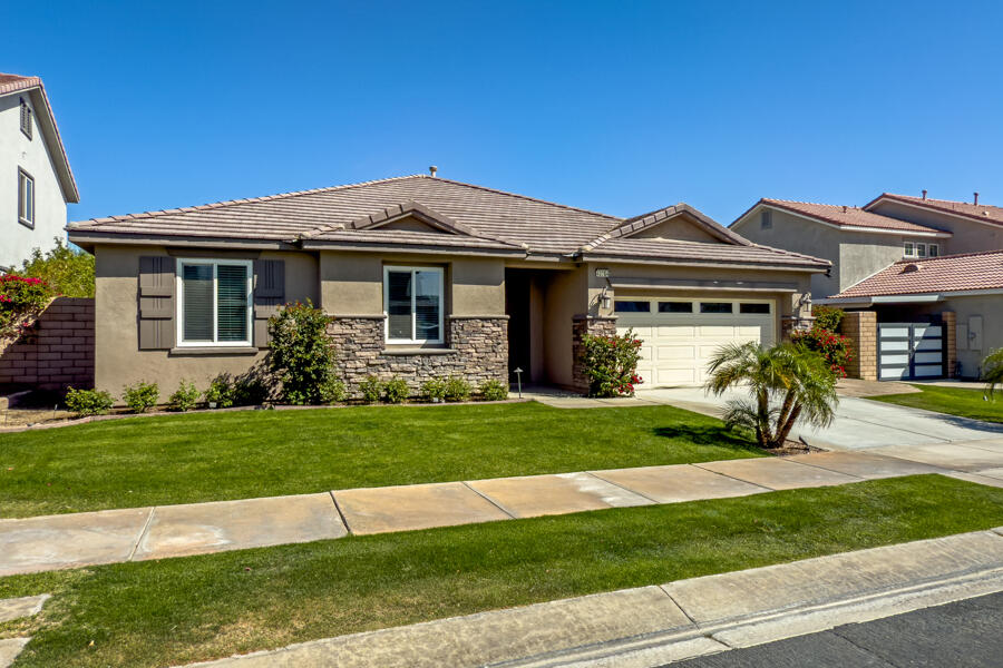 43784 Riunione Place Indio, CA 92203 - Photo 54 of 54 a front view of a house with a yard