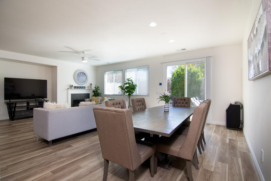 43784 Riunione Place Indio, CA 92203 - Photo 6 of 54 a view of a dining room with furniture window and wooden floor