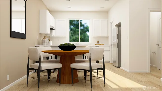 a kitchen with a table chairs and window