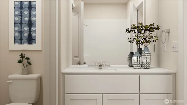 a bathroom with a sink a mirror and a toilet