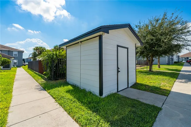 a backyard of a house with lots of green space
