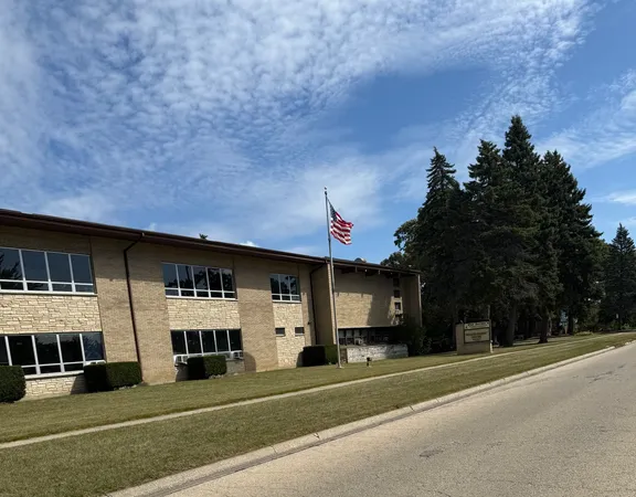 a view of city with tall buildings and a yard