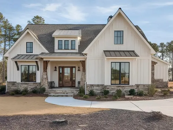 a front view of a house with yard