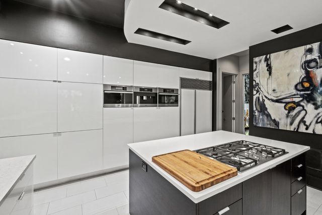 a living room with furniture a fireplace and a window