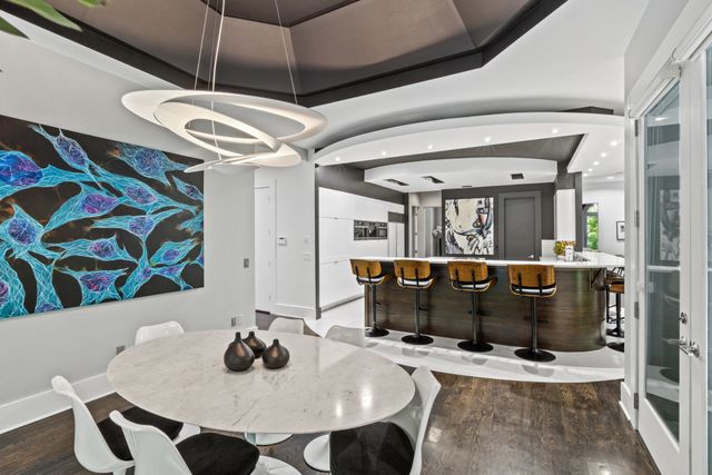 a bathroom with a sink a mirror and a shower