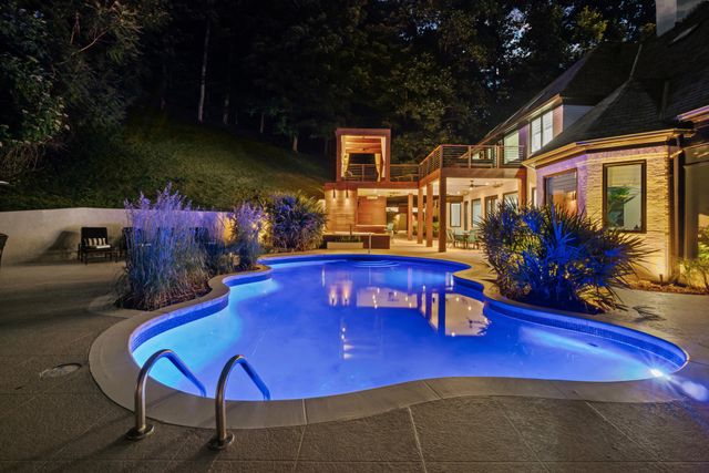 a view of a chairs and table in patio
