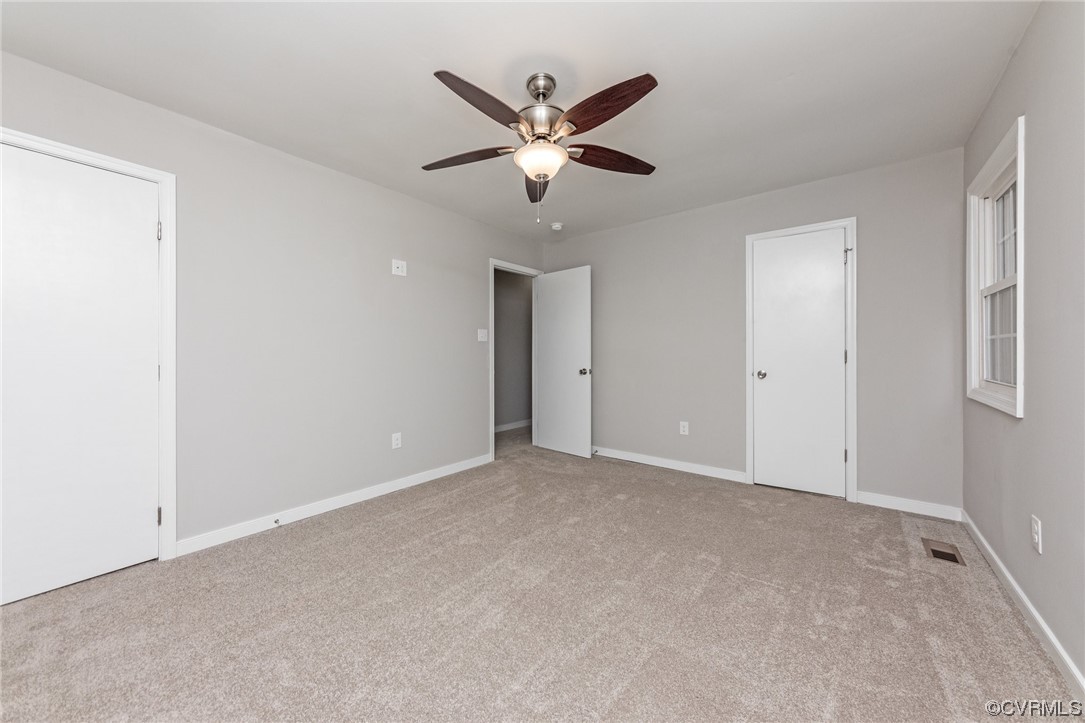 10200 Edgecliff Lane Chesterfield, VA 23832 - Photo 12 of 25 a view of an empty room with a ceiling fan