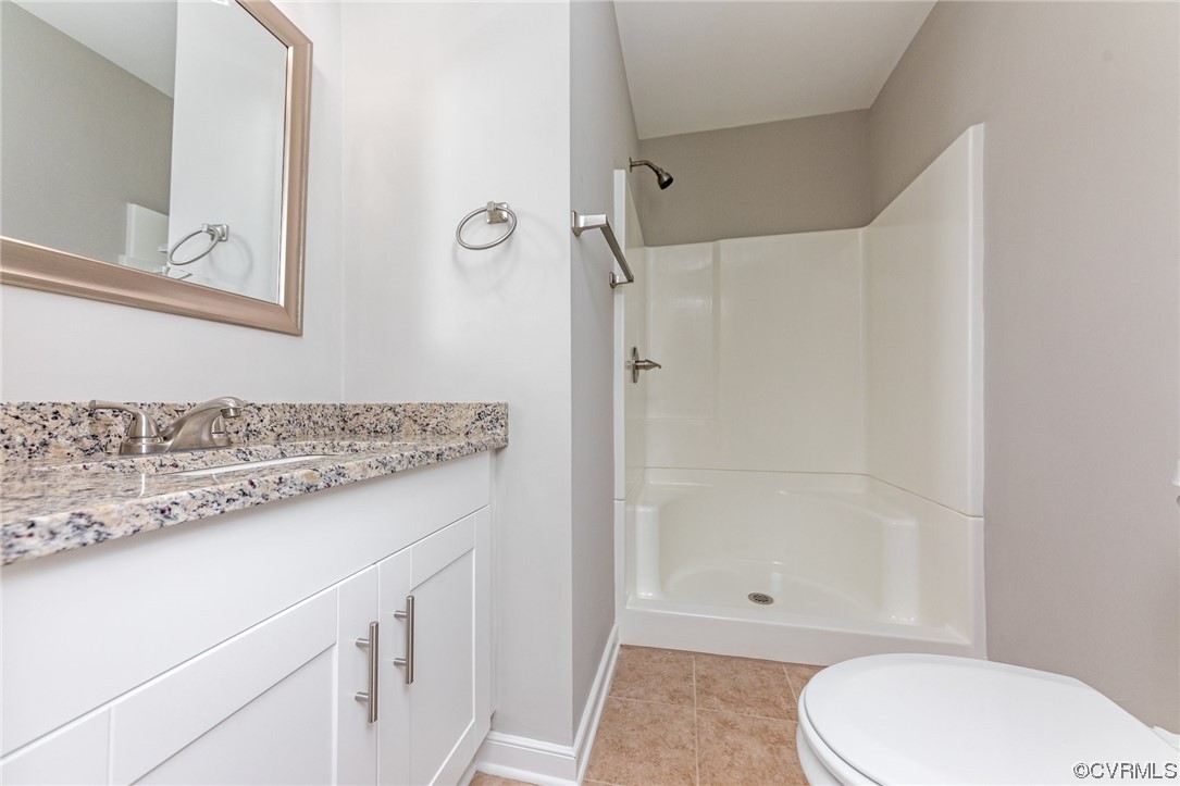 10200 Edgecliff Lane Chesterfield, VA 23832 - Photo 14 of 25 a bathroom with a granite countertop sink toilet and shower