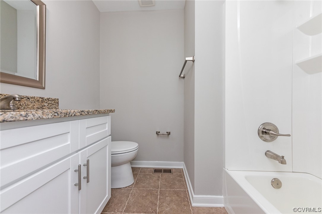 10200 Edgecliff Lane Chesterfield, VA 23832 - Photo 20 of 25 a bathroom with a granite countertop sink toilet and shower