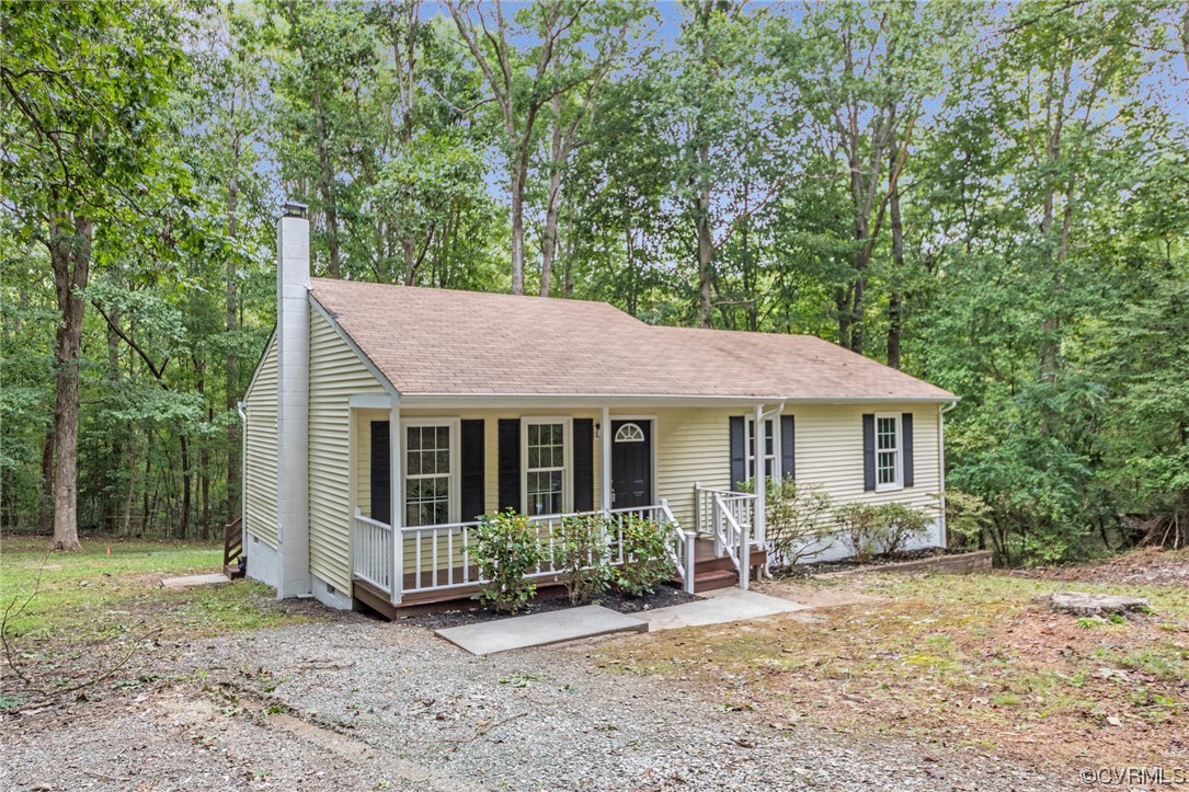 10200 Edgecliff Lane Chesterfield, VA 23832 - Photo 2 of 25 a view of a house with a yard and large trees