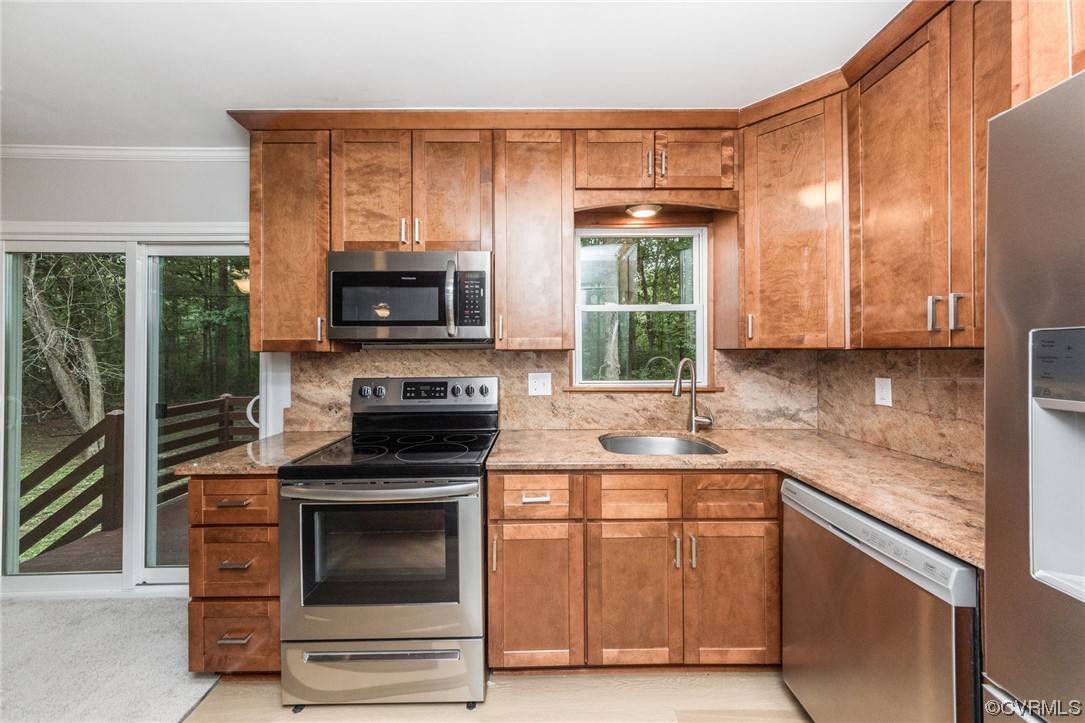 10200 Edgecliff Lane Chesterfield, VA 23832 - Photo 4 of 25 a kitchen with a sink stove and microwave