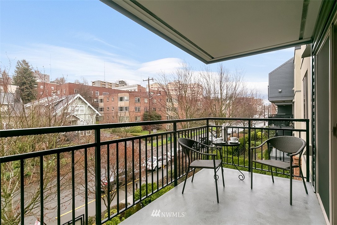 275 West Roy Street, Unit 319 Seattle, WA 98119 - Photo 1 of 18 a view of a balcony with chairs