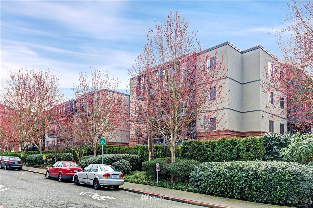 275 West Roy Street, Unit 319 Seattle, WA 98119 - Photo 11 of 18 a car parked in front of a building