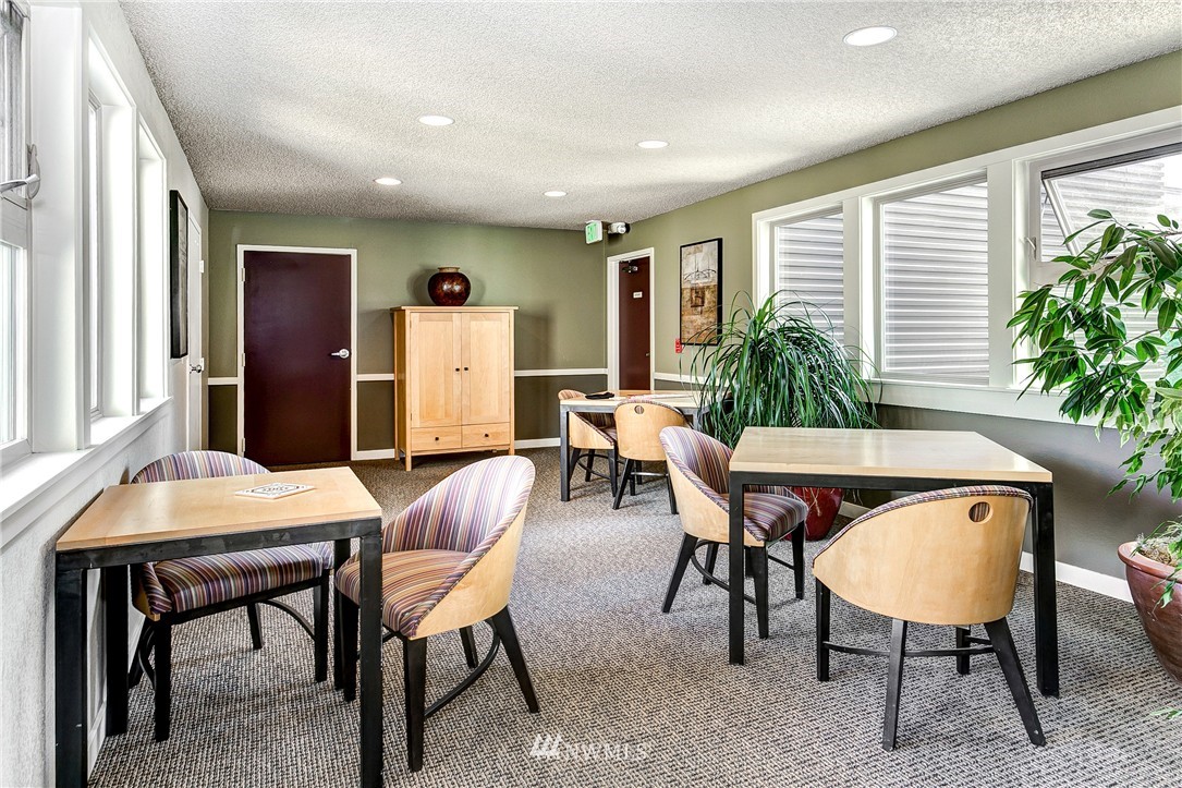 275 West Roy Street, Unit 319 Seattle, WA 98119 - Photo 15 of 18 a dinning room with furniture and window