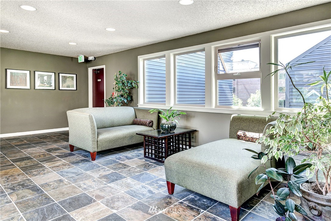 275 West Roy Street, Unit 319 Seattle, WA 98119 - Photo 16 of 18 a living room with furniture and a large window
