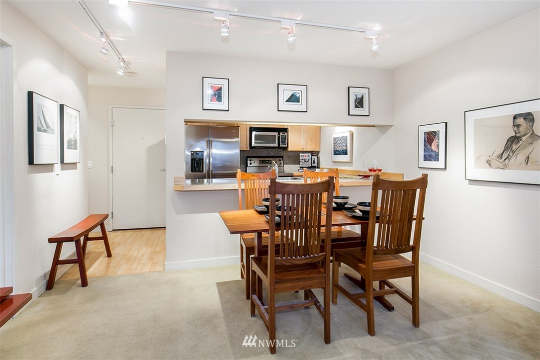 275 West Roy Street, Unit 319 Seattle, WA 98119 - Photo 6 of 18 a view of a dining room with furniture