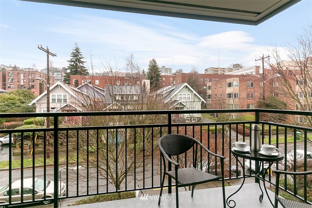 275 West Roy Street, Unit 319 Seattle, WA 98119 - Photo 10 of 18 a view of a balcony with wooden floor