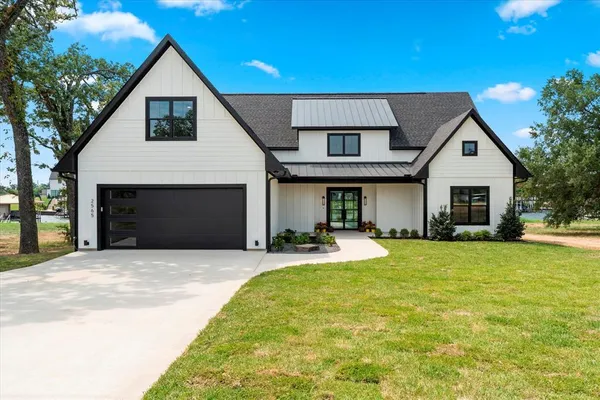 a front view of a house with having yard