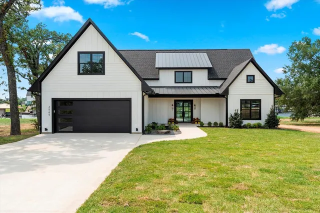 a front view of a house with having yard
