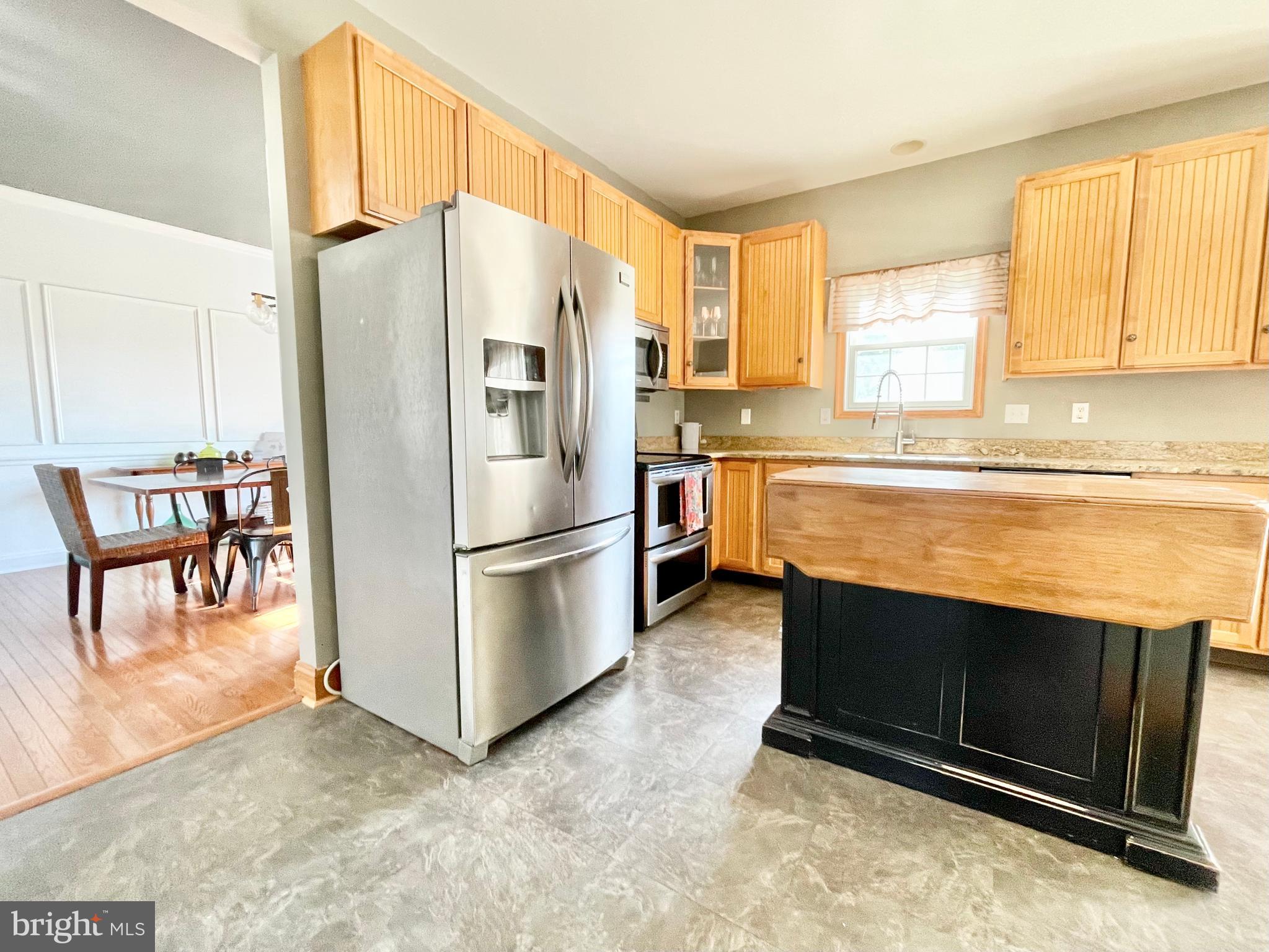 78 Jillian Drive Dover, DE 19901 - Photo 14 of 42 a kitchen with stainless steel appliances granite countertop a refrigerator and a stove top oven