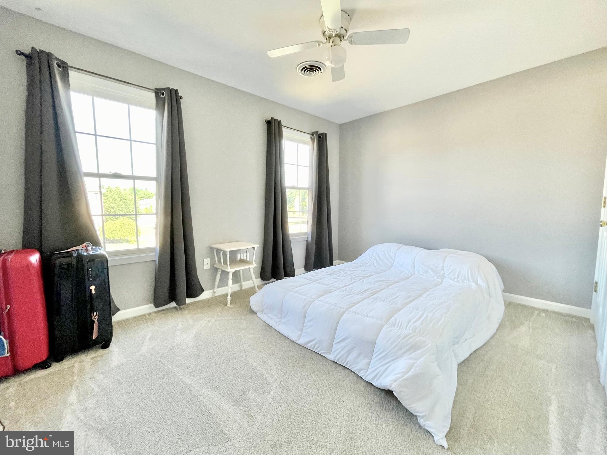 78 Jillian Drive Dover, DE 19901 - Photo 32 of 42 a bedroom with a bed and window with lamp