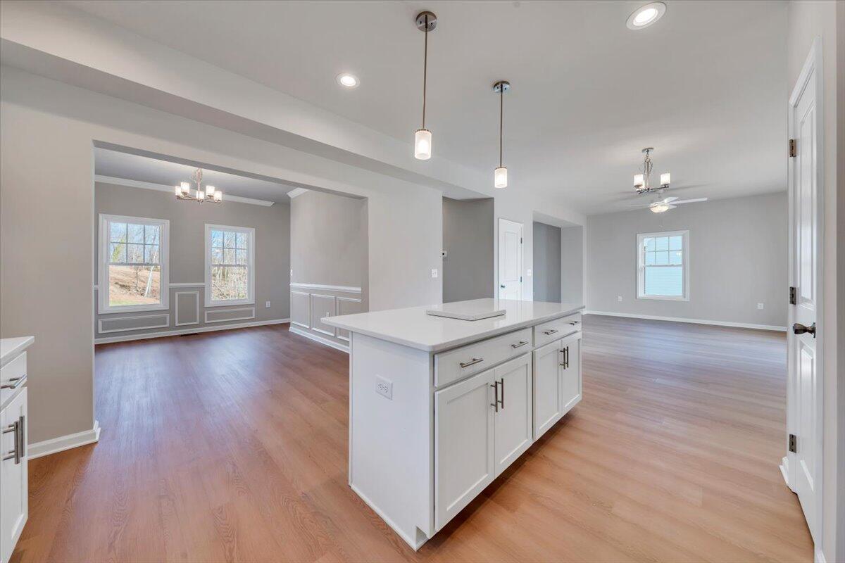 3724 Crescent Ridge Drive Southwest Roanoke, VA 24015 - Photo 7 of 23 a large kitchen with a wooden floor and a sink