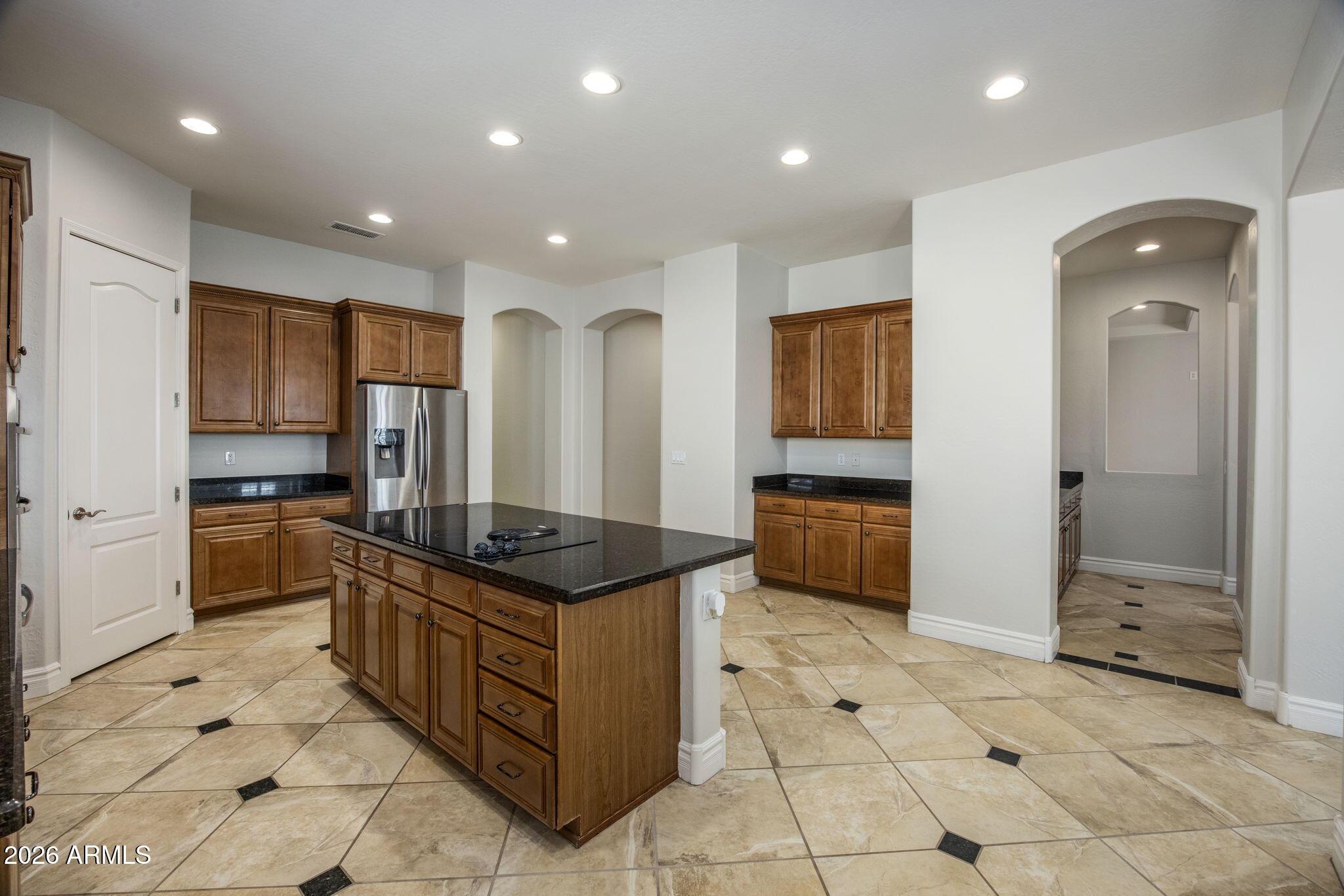 3215 East Constance Way Phoenix, AZ 85042 - Photo 12 of 40 a kitchen with stainless steel appliances granite countertop a refrigerator and a stove