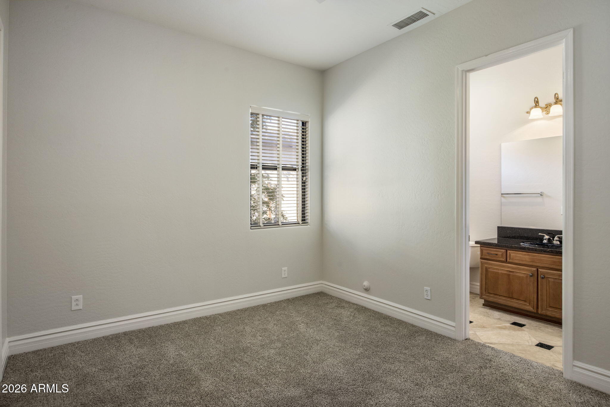 3215 East Constance Way Phoenix, AZ 85042 - Photo 16 of 40 an empty room with windows