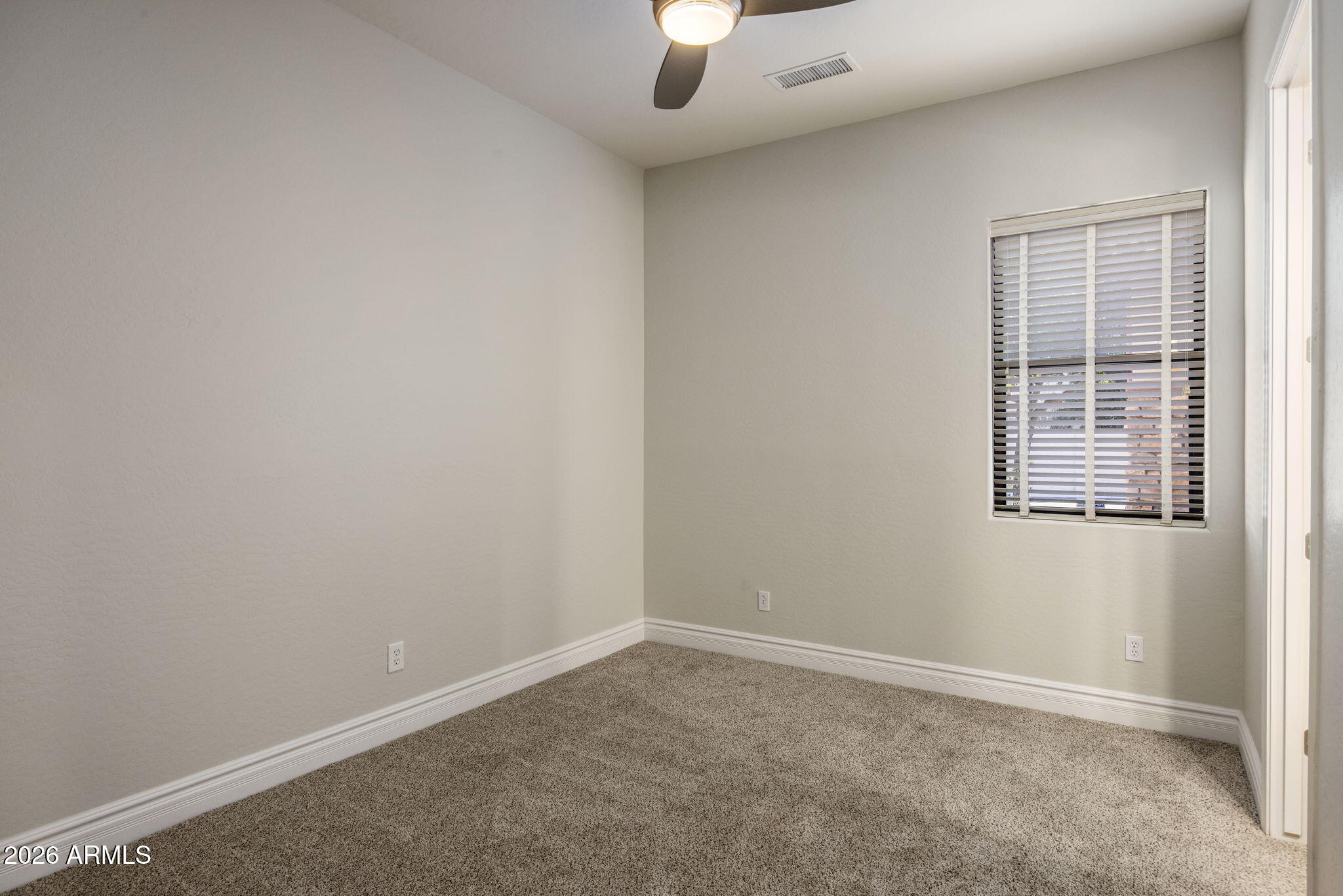3215 East Constance Way Phoenix, AZ 85042 - Photo 17 of 40 an empty room with a window