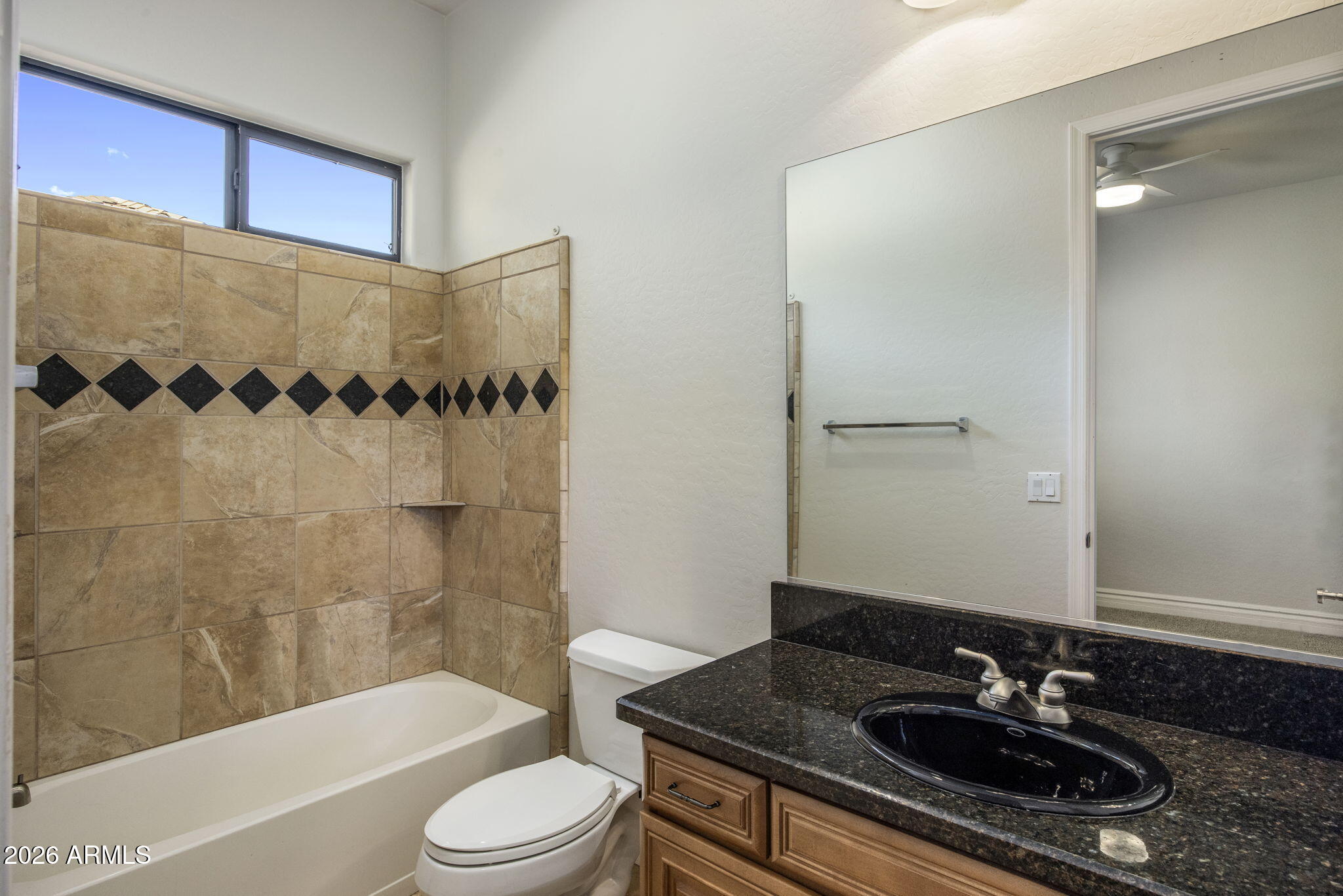3215 East Constance Way Phoenix, AZ 85042 - Photo 20 of 40 a bathroom with a sink and a mirror
