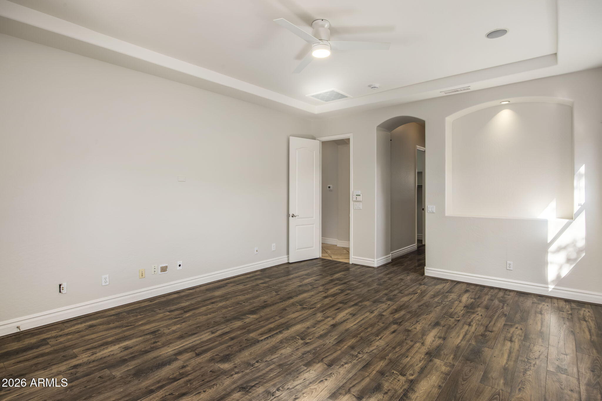 3215 East Constance Way Phoenix, AZ 85042 - Photo 22 of 40 wooden floor in an empty room with a window