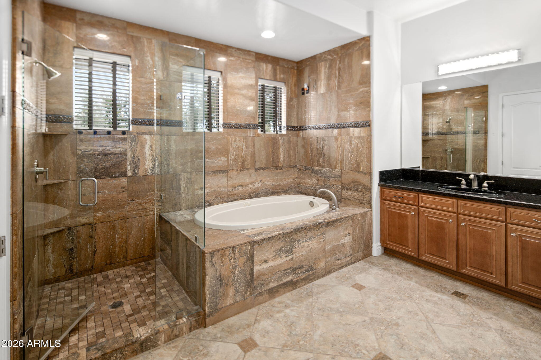 3215 East Constance Way Phoenix, AZ 85042 - Photo 24 of 40 a bathroom with a sink a toilet and shower